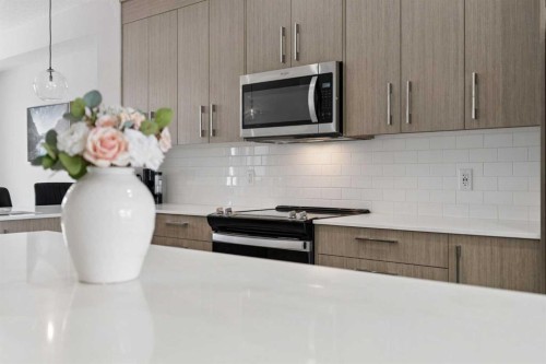 556 Chelsea Gardens, Chestermere, AB - Indoor Photo Showing Kitchen With Upgraded Kitchen