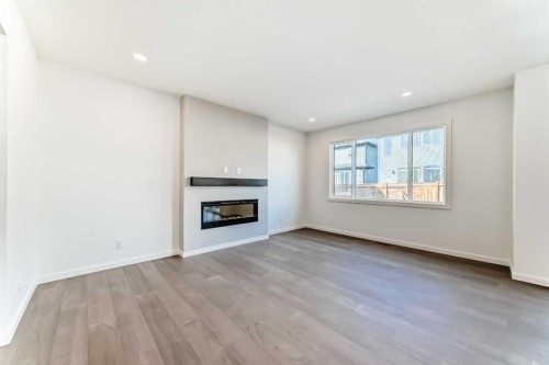 196 Starling Place Nw, Calgary, AB - Indoor Photo Showing Living Room With Fireplace