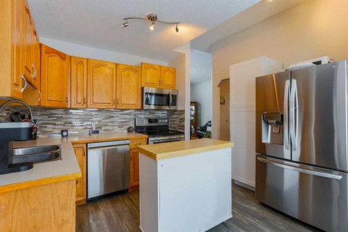 1118 Maple Avenue, Crossfield, AB - Indoor Photo Showing Kitchen With Double Sink