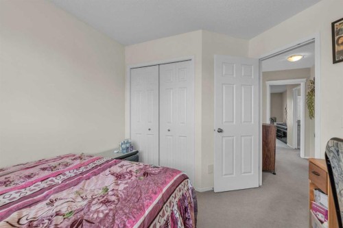 115 Evermeadow Avenue Sw, Calgary, AB - Indoor Photo Showing Bedroom