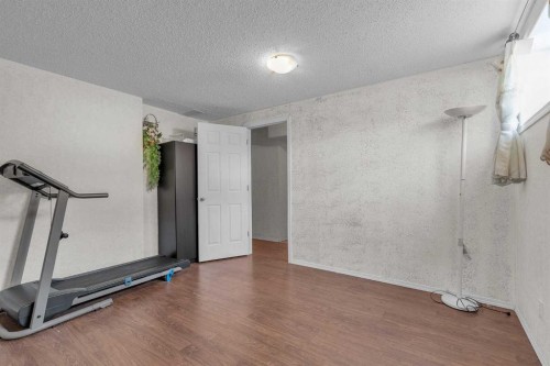 115 Evermeadow Avenue Sw, Calgary, AB - Indoor Photo Showing Gym Room