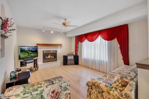 133 Riverview Park Se, Calgary, AB - Indoor Photo Showing Bedroom With Fireplace