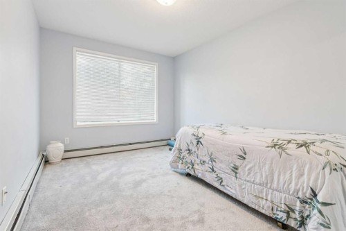 105-15320 Bannister Road Se, Calgary, AB - Indoor Photo Showing Bedroom