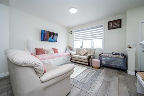 358 Chelsea Common, Chestermere, AB - Indoor Photo Showing Living Room