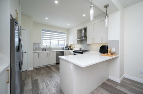 358 Chelsea Common, Chestermere, AB - Indoor Photo Showing Kitchen With Upgraded Kitchen