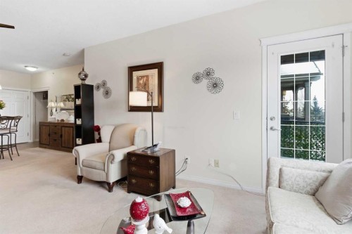 305-37 Prestwick Drive Se, Calgary, AB - Indoor Photo Showing Living Room
