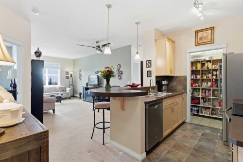 305-37 Prestwick Drive Se, Calgary, AB - Indoor Photo Showing Kitchen With Double Sink