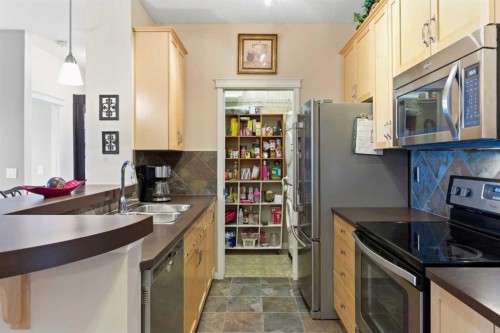 305-37 Prestwick Drive Se, Calgary, AB - Indoor Photo Showing Kitchen With Double Sink
