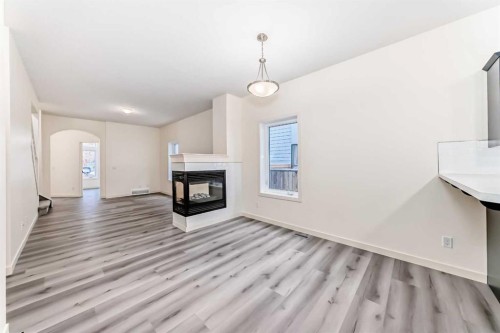 2006 37 Street Se, Calgary, AB - Indoor Photo Showing Living Room With Fireplace
