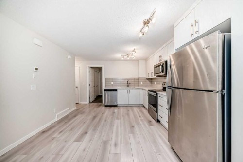 152 Cranbrook Square Se, Calgary, AB - Indoor Photo Showing Kitchen With Stainless Steel Kitchen