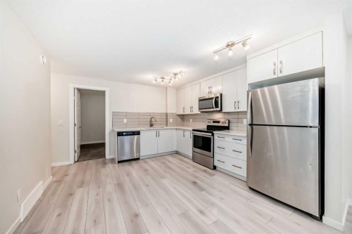 152 Cranbrook Square Se, Calgary, AB - Indoor Photo Showing Kitchen With Stainless Steel Kitchen