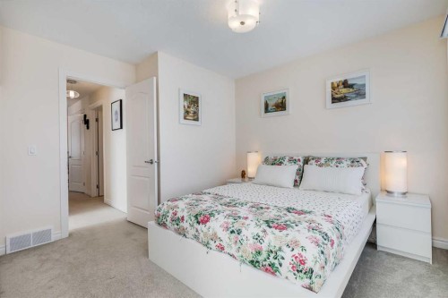 87 Evanswood Circle Nw, Calgary, AB - Indoor Photo Showing Bedroom
