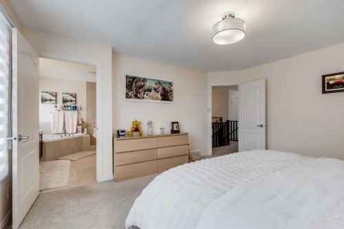 87 Evanswood Circle Nw, Calgary, AB - Indoor Photo Showing Bedroom