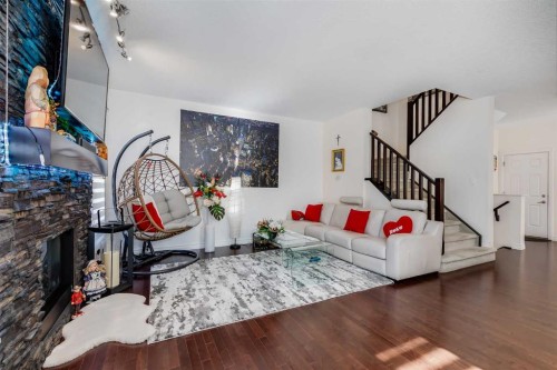 87 Evanswood Circle Nw, Calgary, AB - Indoor Photo Showing Living Room With Fireplace