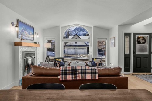 157 Cougar Point Road, Canmore, AB - Indoor Photo Showing Living Room With Fireplace