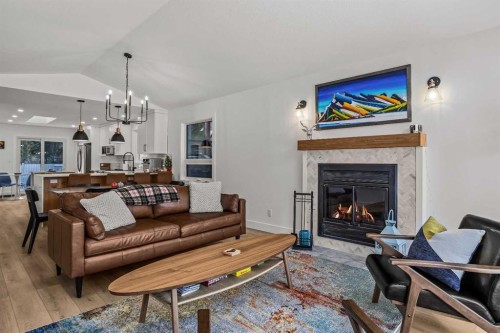 157 Cougar Point Road, Canmore, AB - Indoor Photo Showing Living Room With Fireplace