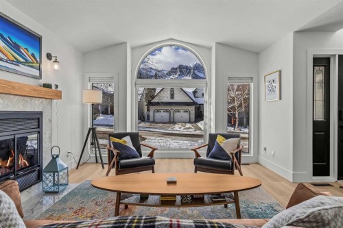 157 Cougar Point Road, Canmore, AB - Indoor Photo Showing Living Room With Fireplace