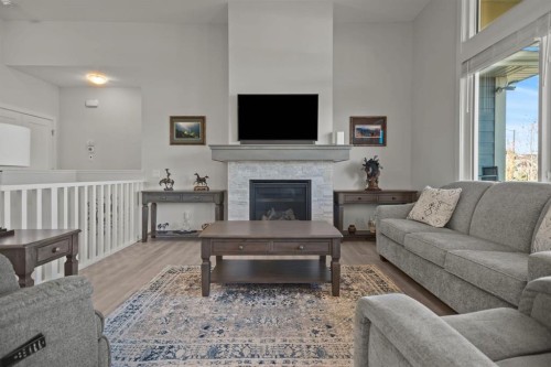 4 Cimarron Estates Gardens, Okotoks, AB - Indoor Photo Showing Living Room With Fireplace
