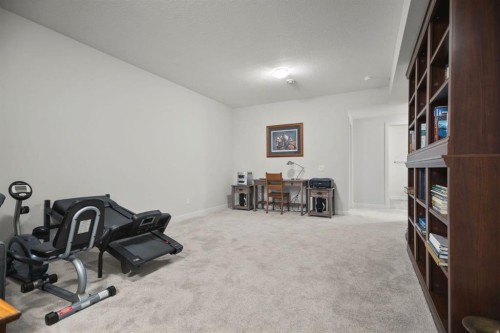 4 Cimarron Estates Gardens, Okotoks, AB - Indoor Photo Showing Gym Room