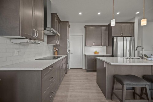 4 Cimarron Estates Gardens, Okotoks, AB - Indoor Photo Showing Kitchen With Stainless Steel Kitchen With Upgraded Kitchen