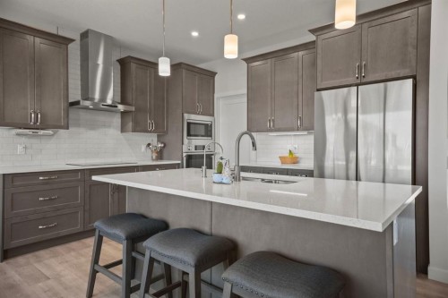 4 Cimarron Estates Gardens, Okotoks, AB - Indoor Photo Showing Kitchen With Upgraded Kitchen