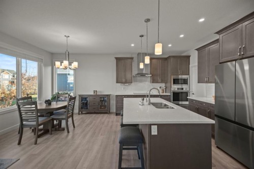 4 Cimarron Estates Gardens, Okotoks, AB - Indoor Photo Showing Kitchen With Stainless Steel Kitchen With Double Sink With Upgraded Kitchen