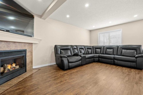 332 Oakmere Way, Chestermere, AB - Indoor Photo Showing Living Room With Fireplace