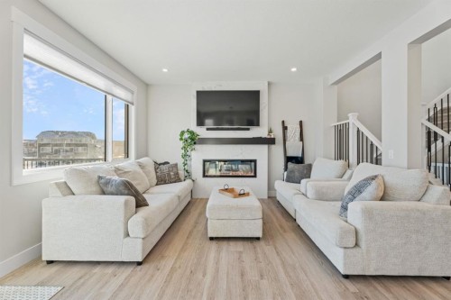 235 Chelsea Park, Chestermere, AB - Indoor Photo Showing Living Room With Fireplace