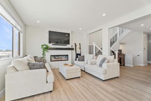 235 Chelsea Park, Chestermere, AB - Indoor Photo Showing Living Room With Fireplace