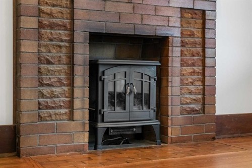 1640 15 Street Se, Calgary, AB - Indoor Photo Showing Other Room With Fireplace