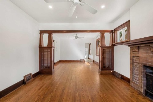 1640 15 Street Se, Calgary, AB - Indoor Photo Showing Other Room With Fireplace