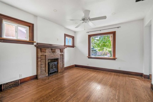 1640 15 Street Se, Calgary, AB - Indoor Photo Showing Other Room With Fireplace