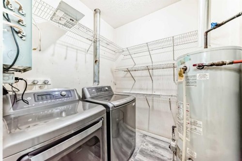 205-7 Lineham Avenue, Okotoks, AB - Indoor Photo Showing Laundry Room