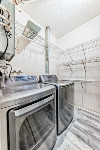 205-7 Lineham Avenue, Okotoks, AB - Indoor Photo Showing Laundry Room