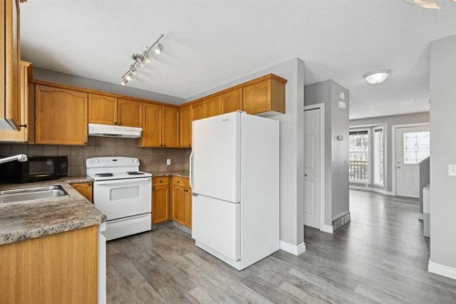 42 Hidden Hills Way Nw, Calgary, AB - Indoor Photo Showing Kitchen With Double Sink