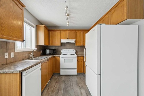 42 Hidden Hills Way Nw, Calgary, AB - Indoor Photo Showing Kitchen With Double Sink