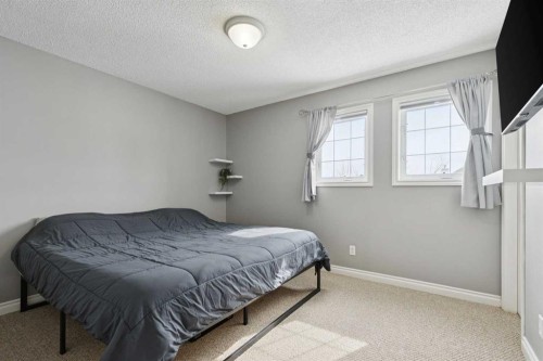 42 Hidden Hills Way Nw, Calgary, AB - Indoor Photo Showing Bedroom