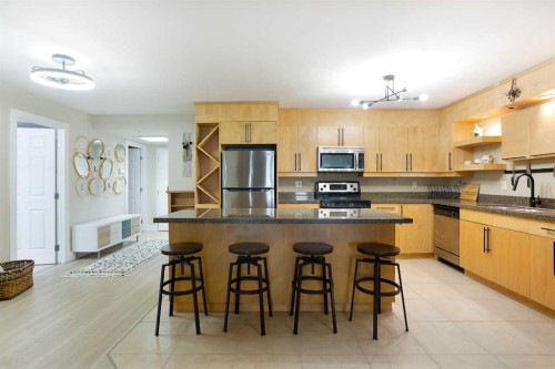 102-350 4 Avenue Ne, Calgary, AB - Indoor Photo Showing Kitchen With Stainless Steel Kitchen