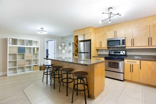 102-350 4 Avenue Ne, Calgary, AB - Indoor Photo Showing Kitchen With Stainless Steel Kitchen