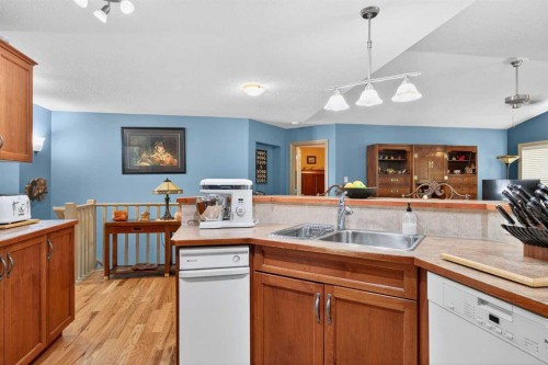 125 Copeland Close, Langdon, AB - Indoor Photo Showing Kitchen With Double Sink