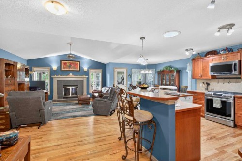 125 Copeland Close, Langdon, AB - Indoor With Fireplace