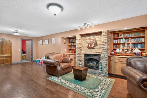 125 Copeland Close, Langdon, AB - Indoor Photo Showing Living Room With Fireplace