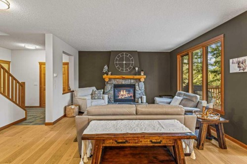 215 Miskow Close, Canmore, AB - Indoor Photo Showing Living Room With Fireplace