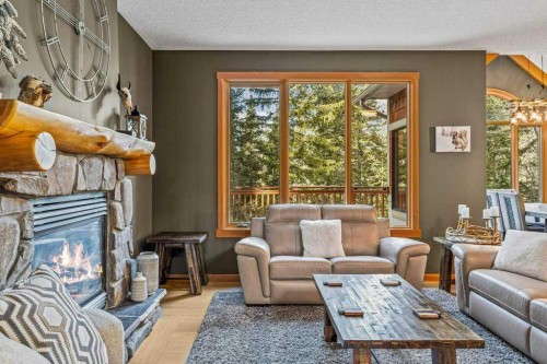 215 Miskow Close, Canmore, AB - Indoor Photo Showing Living Room With Fireplace