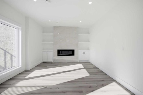 8520 33 Avenue Nw, Calgary, AB - Indoor Photo Showing Other Room With Fireplace