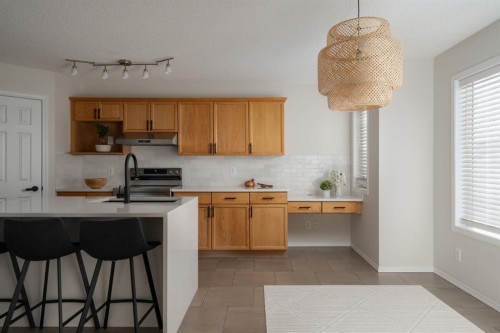 641 Evermeadow Road Sw, Calgary, AB - Indoor Photo Showing Kitchen With Double Sink