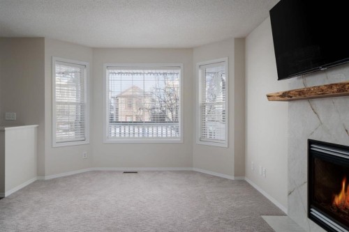 641 Evermeadow Road Sw, Calgary, AB - Indoor With Fireplace
