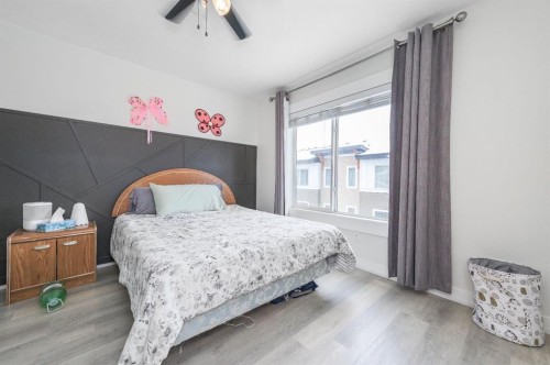 59-111 Rainbow Falls Gate, Chestermere, AB - Indoor Photo Showing Bedroom