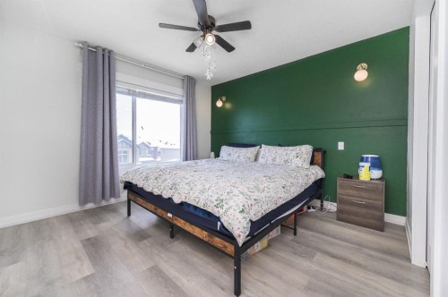 59-111 Rainbow Falls Gate, Chestermere, AB - Indoor Photo Showing Bedroom