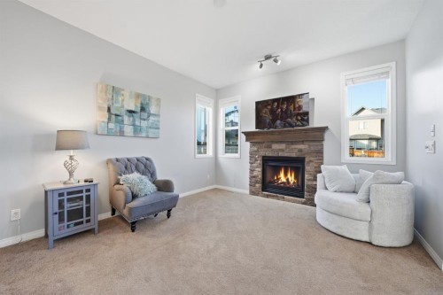 99 Sage Valley Park Nw, Calgary, AB - Indoor Photo Showing Living Room With Fireplace